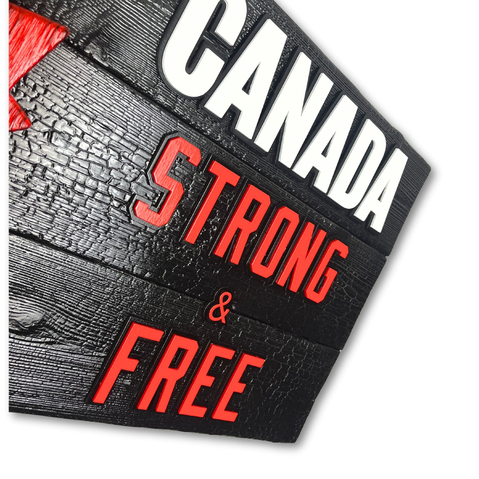 Side angle of Canadian wood flag showing thickness and 3D layered maple leaf and lettering