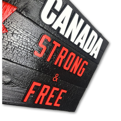 Side angle of Canadian wood flag showing thickness and 3D layered maple leaf and lettering