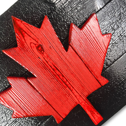 Detailed view of charred cedar grain on handcrafted Canadian wood flag
