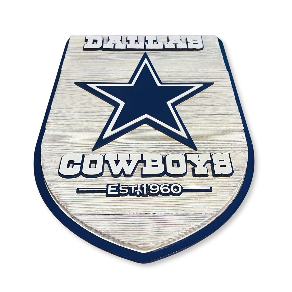 Metallic emblem with star design and 'Cowboys' text on a white background