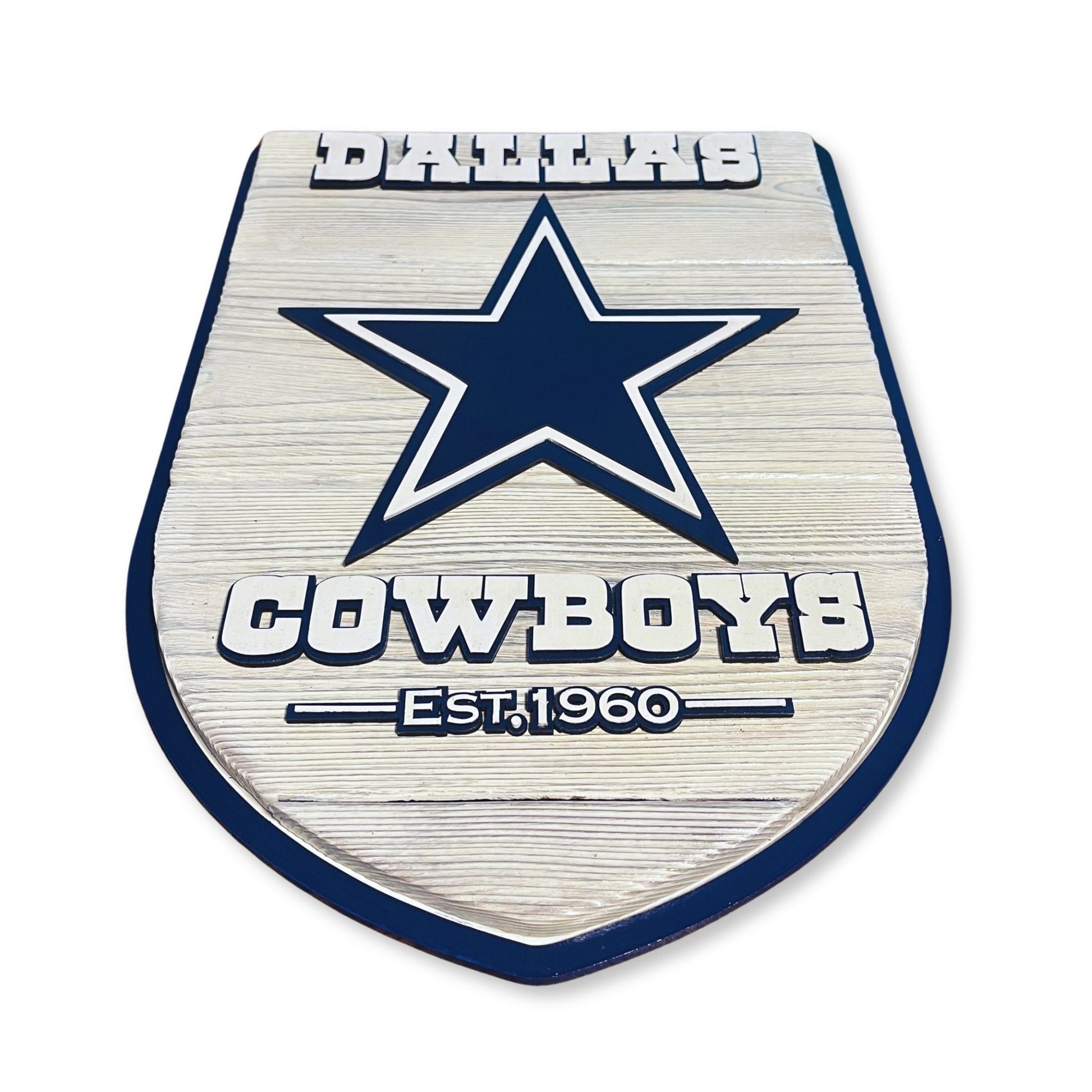 Metallic emblem with star design and 'Cowboys' text on a white background