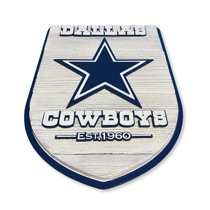 Metallic emblem with star design and 'Cowboys' text on a white background