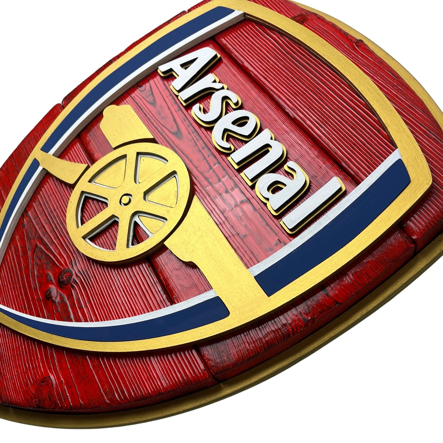 Close up of layered Arsenal wood sign with raised lettering and cannon detail