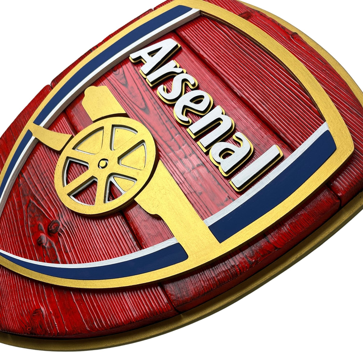 Close up of layered Arsenal wood sign with raised lettering and cannon detail