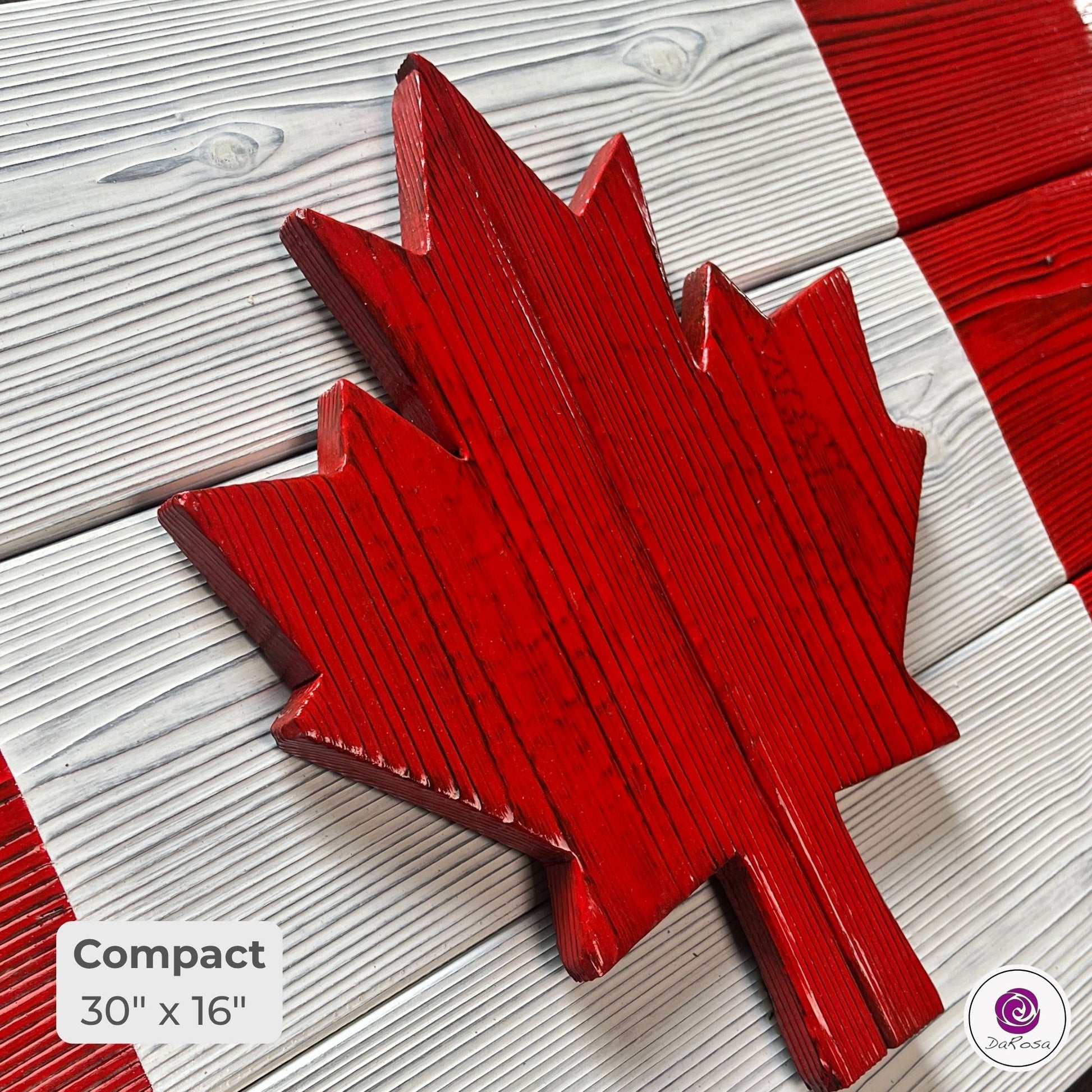 Close-up of compact Canadian wood flag showing detailed charred cedar grain and texture
