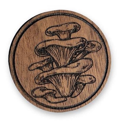 Close-up of walnut wood grain and laser engraved mushroom cabinet knob detail