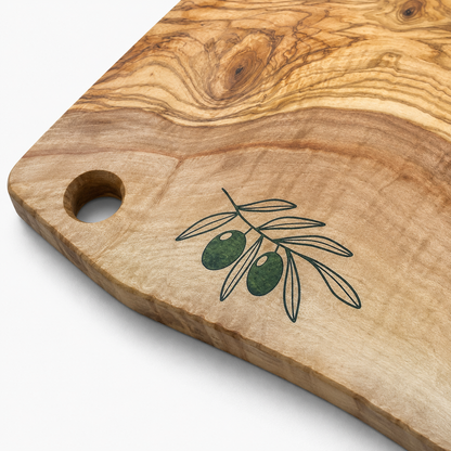 Wooden cutting board with olive design on a white background