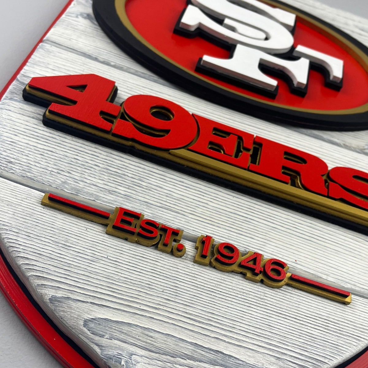 San Francisco 49ers wood shield displayed in man cave football decor setting