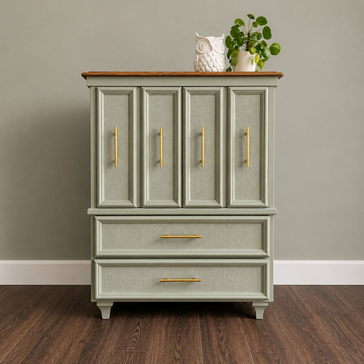 Refinished sage green dresser cabinet with textured fronts and gold hardware
