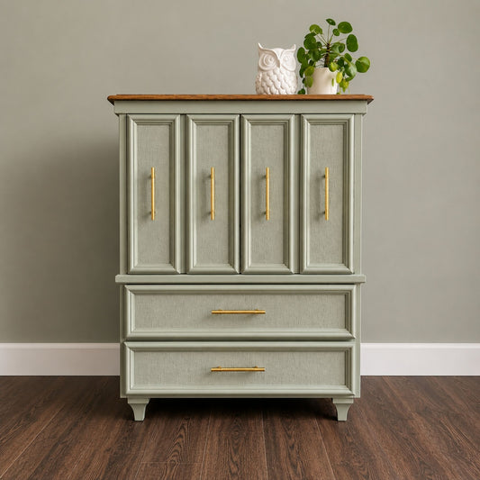 Refinished sage green dresser cabinet with textured fronts and gold hardware